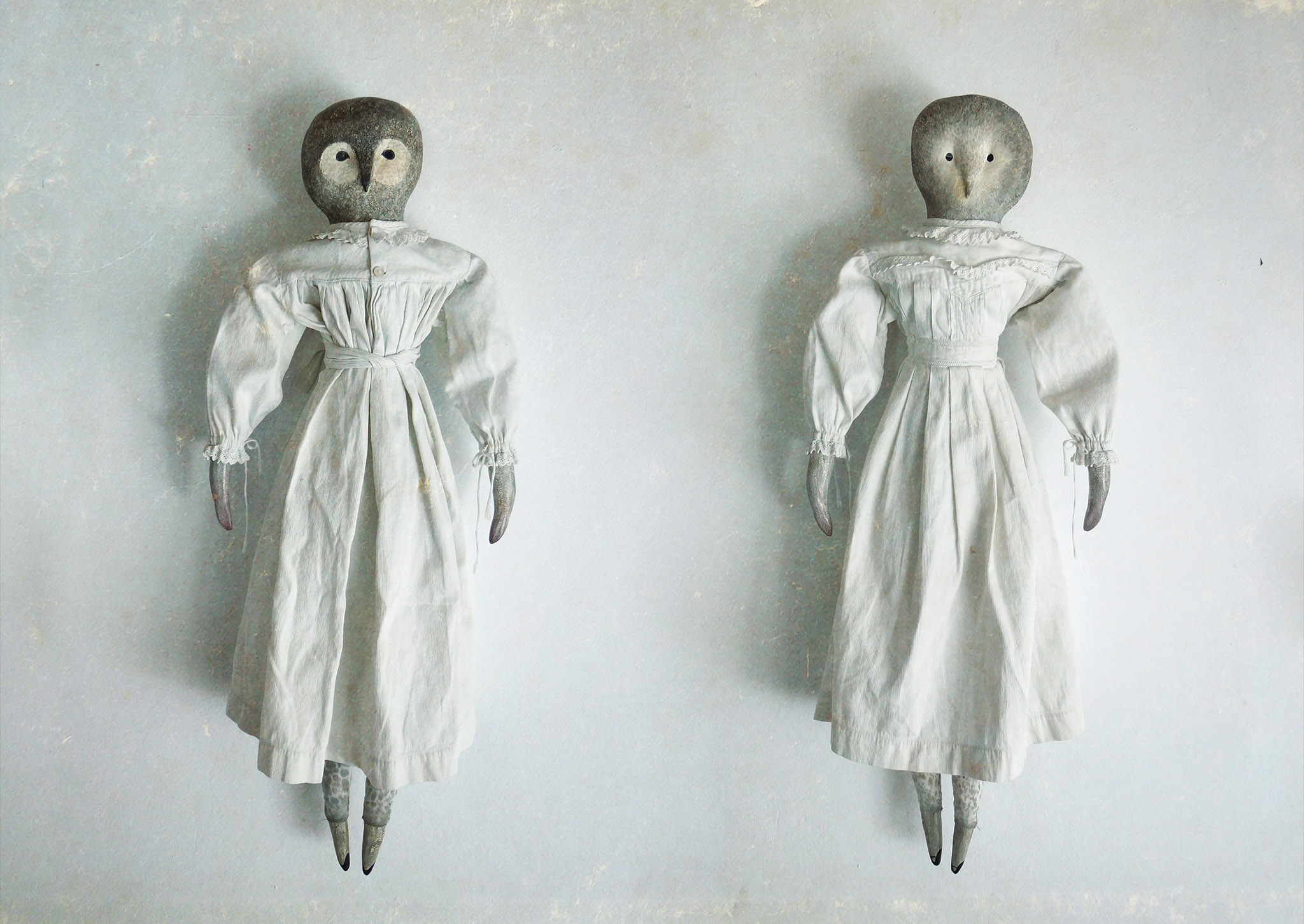 Two handmade owl dolls handmade from textile and ceramic, dressed in antique christening gowns.

A pair of handmade owl dolls crafted from textile and ceramic, dressed in antique christening gowns. A unique textile art piece combining antique vintage clothing, handcrafted details and nostalgic character.